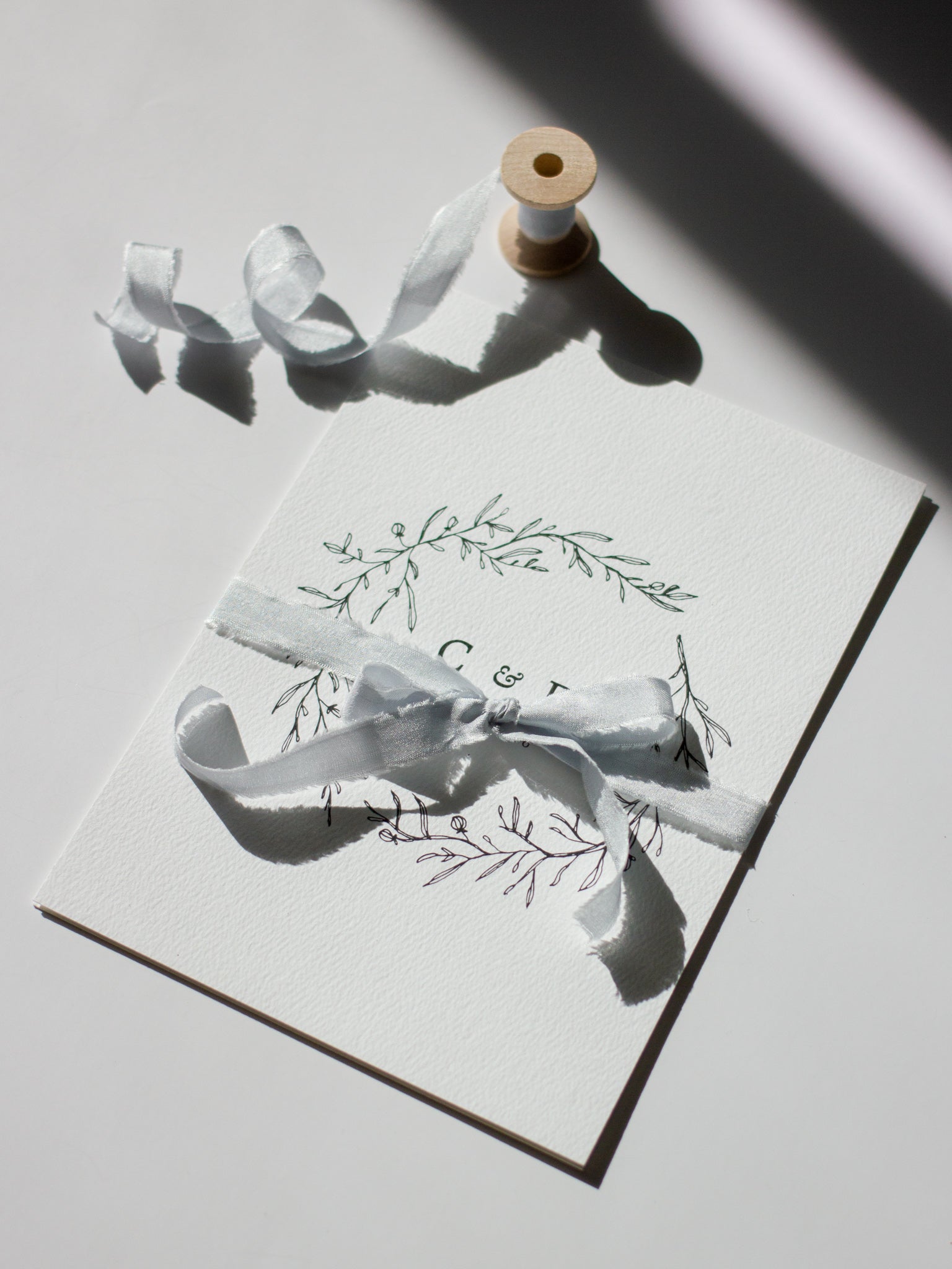 Minimalistic rustic wedding invitations with silk ribbon by Papelu Studio from Vancouver, British Columbia.