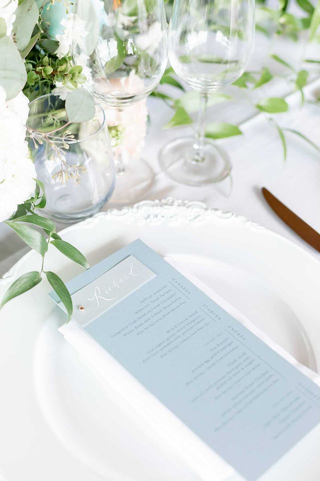 Dusty blue palette on menu cards for a beautiful vineyard wedding in Oliver, British Columbia. Wedding design by Papelu Studio. Photo by Danae Marie Wedding Photography.